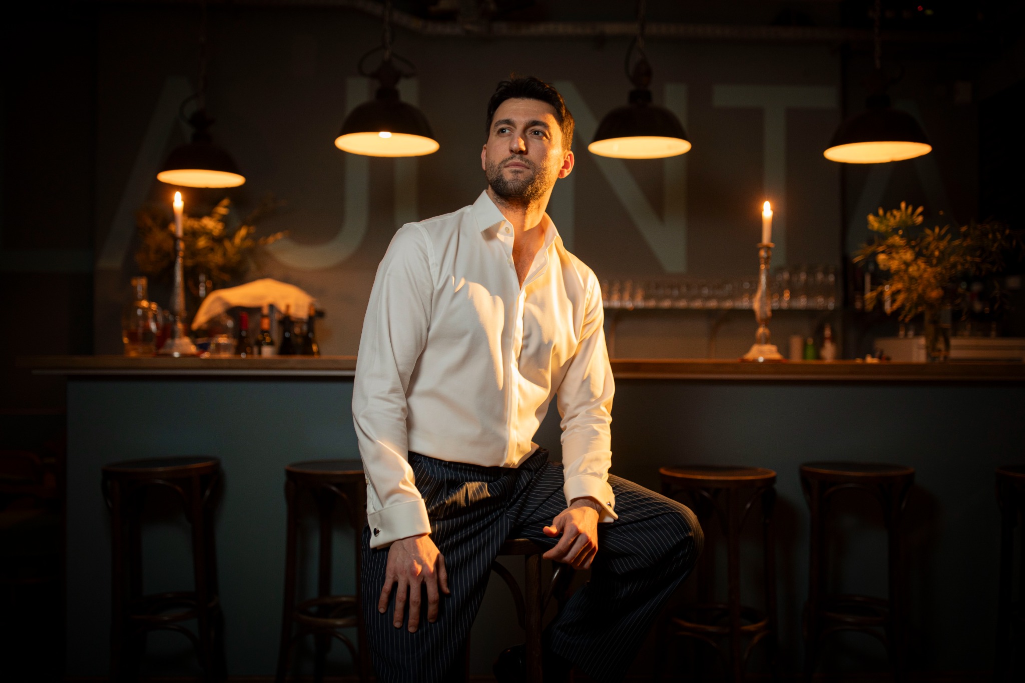 Onur seated at a bar